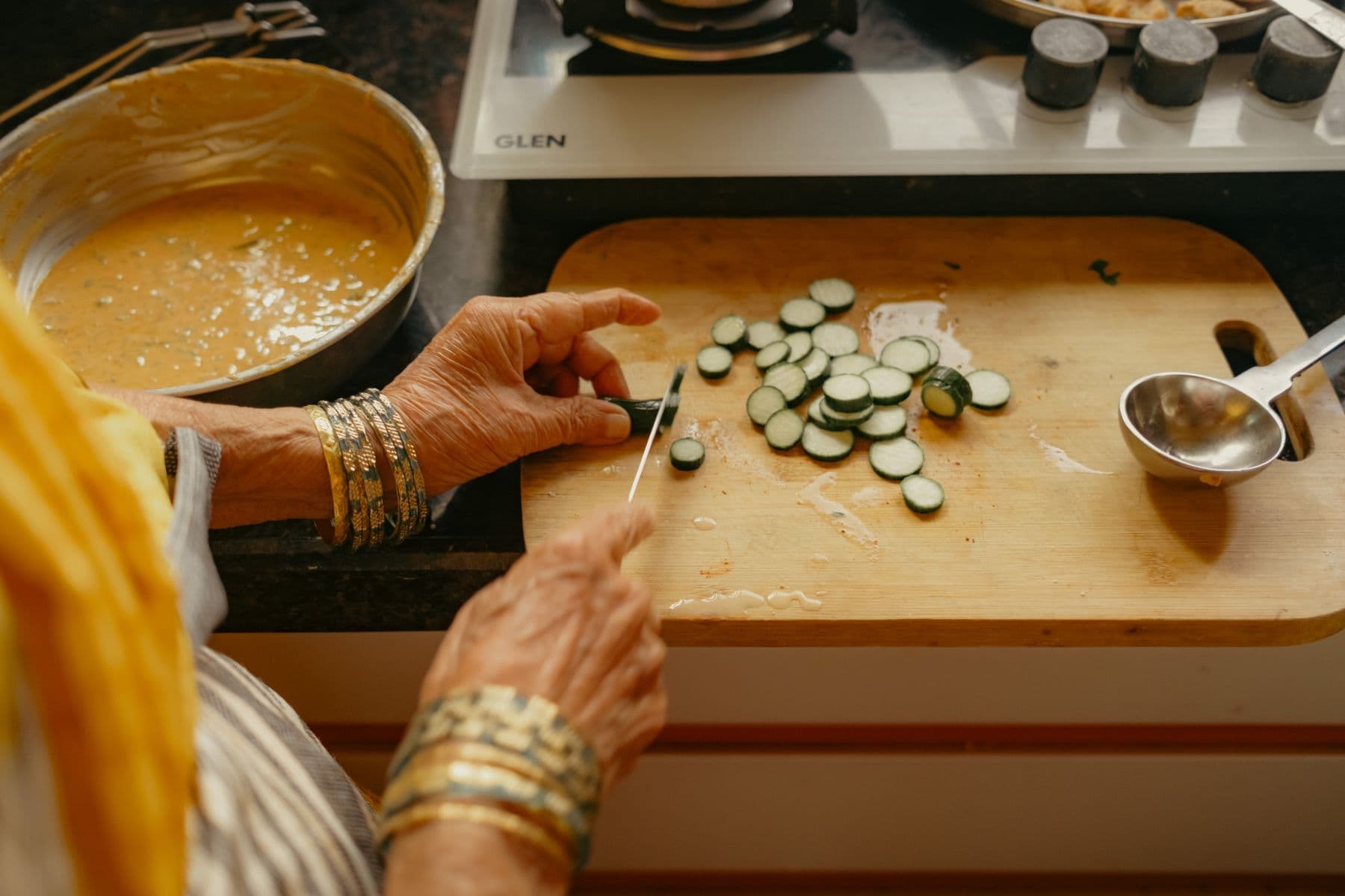 Vegetables being prepared by hand in a home kitchen